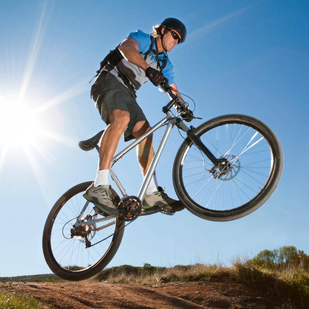 Photo of someone riding a mountain bike on a hill.