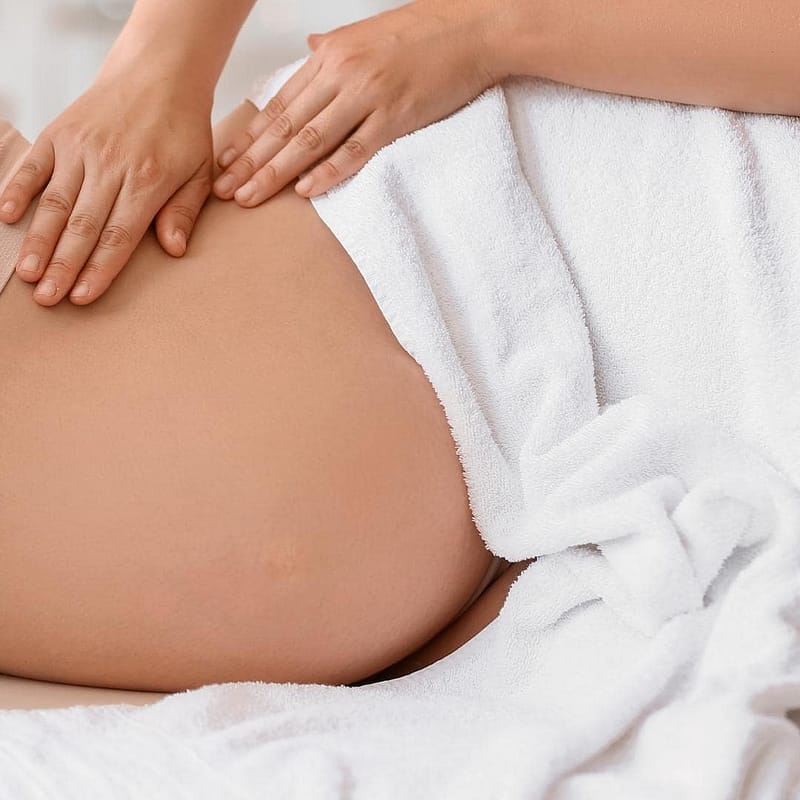 Photo of pregnant person getting a pregnancy massage