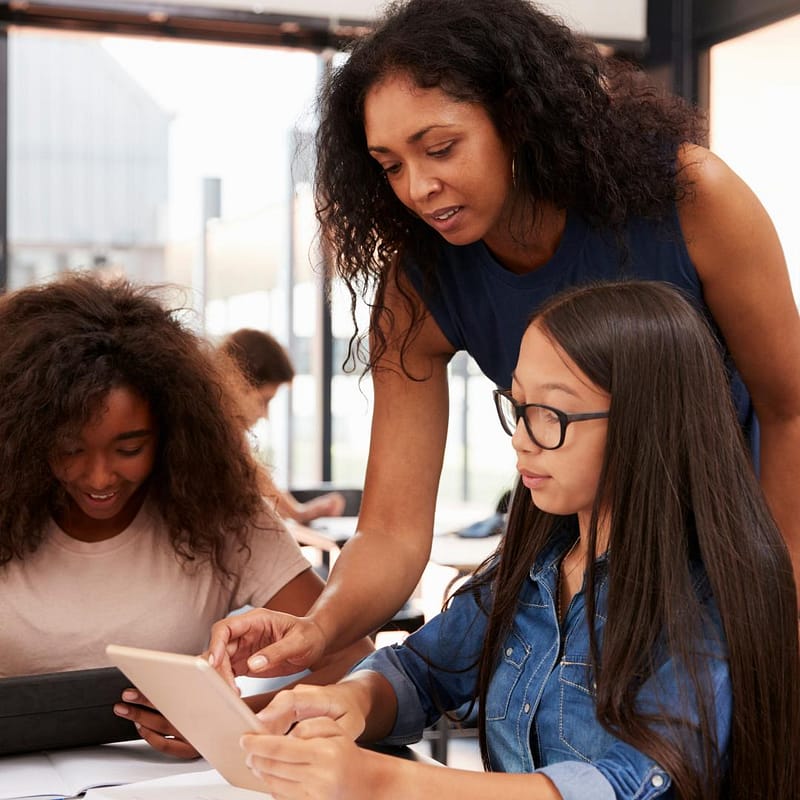 photo of a teacher and 2 of her students