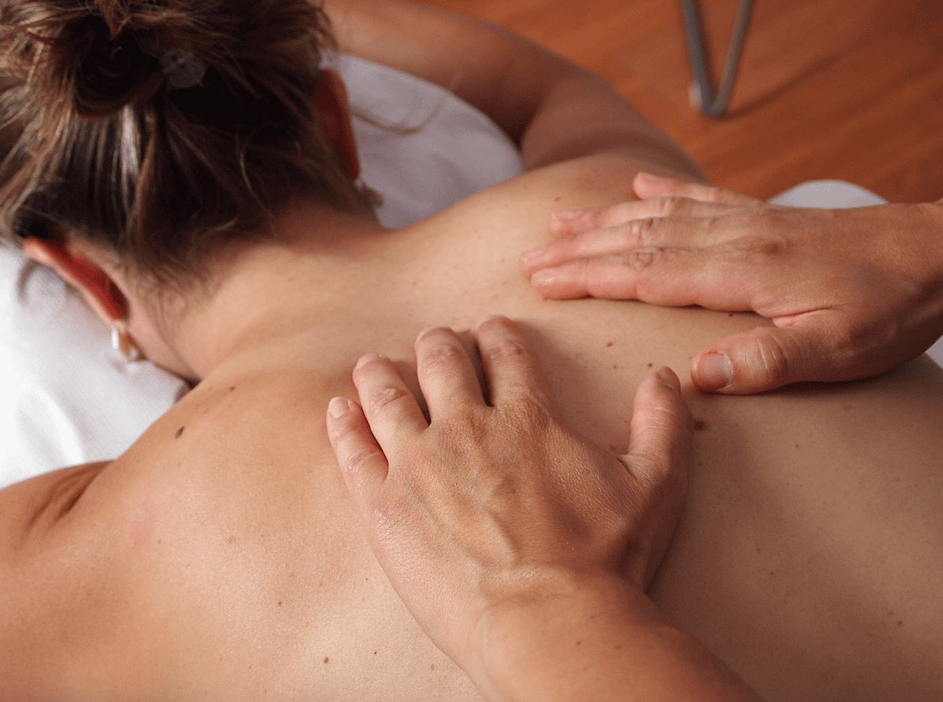 photo of woman getting a back massage